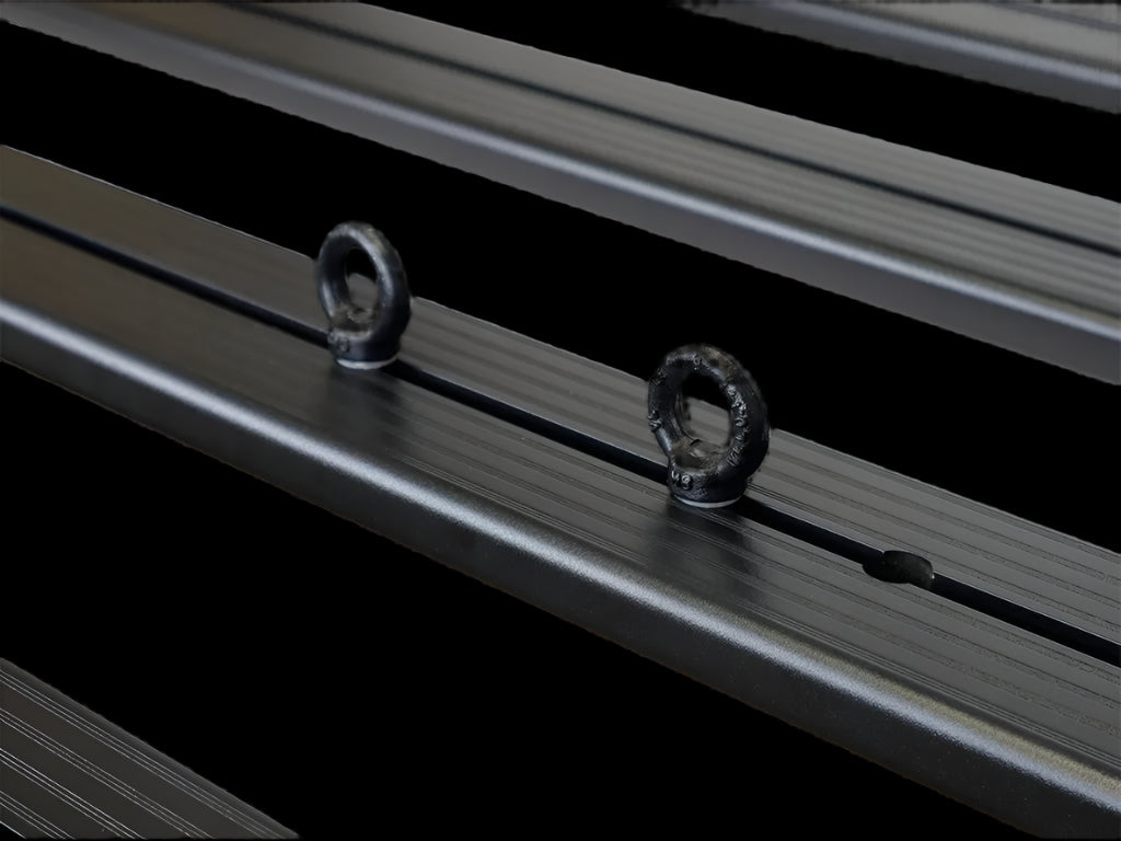 Set of Black Tie Down Rings with M8 hex bolts and nylon washers, ready for tool-free installation on a roof rack