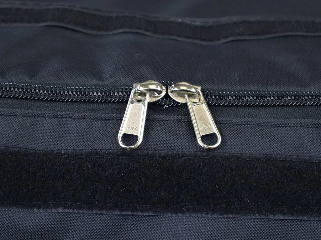 Close-up of the Transit Bag’s heavy-duty zipper and overlapping velcro-sealed fabric lip, highlighting dust and water resistance.