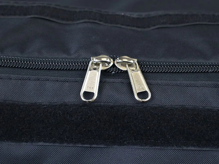 Close-up of the Transit Bag’s heavy-duty zipper and overlapping velcro-sealed fabric lip, highlighting dust and water resistance.