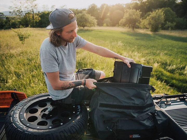 Typhoon Bag loaded with two Cub Packs, demonstrating scalable 90L capacity for organized adventure gear.