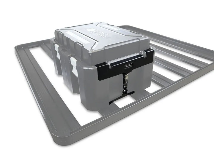 Installation hardware and mounting bracket securing Wolf Pack Pro container on a vehicle roof rack, ready for rugged terrain.