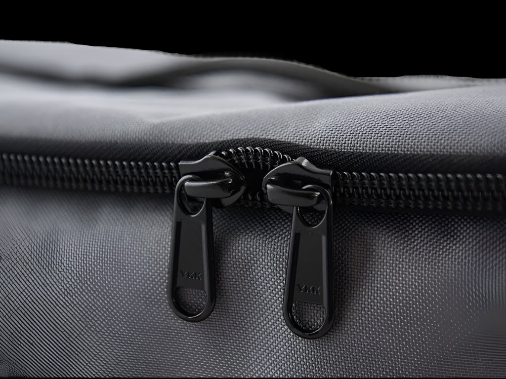 Close-up of Flat Pack’s heavy-duty zipper and durable construction for adventure travel and overlanding storage