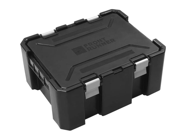 Front Runner Wolf Pack Pro stackable storage box with secure aluminum clasps and sleek black design.