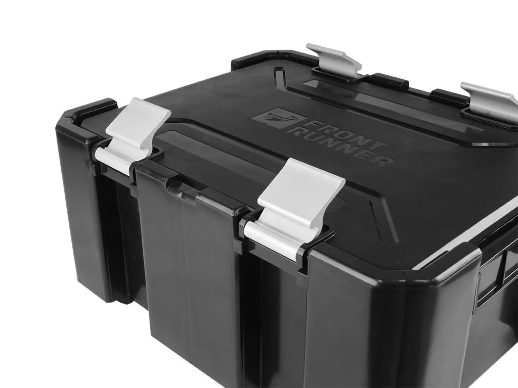 Front Runner Wolf Pack Pro storage box mounted on roof rack using Stratchits tie-down straps.