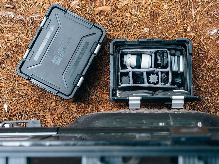 Rugged Wolf Pack Pro storage box protecting camping gear from dust and moisture during outdoor adventures.