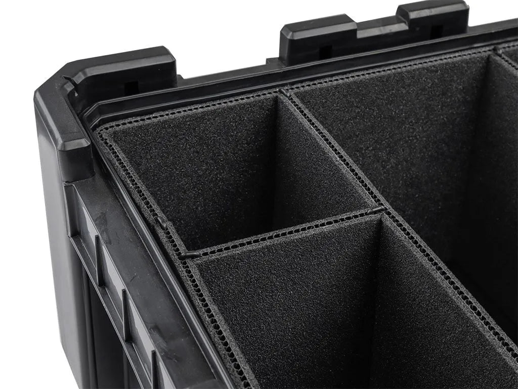 Close-up of grey foam dividers installed in a Cub Pack, creating secure compartments for kitchenware and fragile items