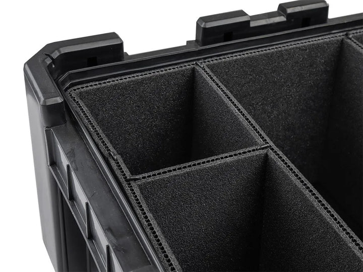 Close-up of grey foam dividers installed in a Cub Pack, creating secure compartments for kitchenware and fragile items