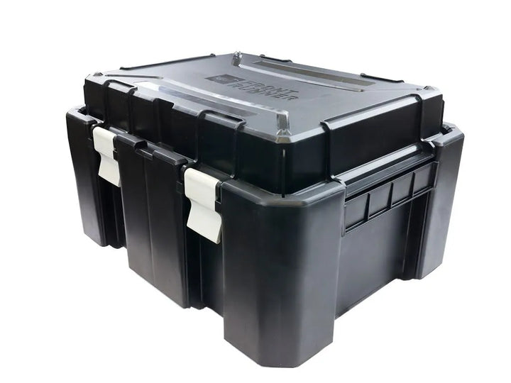 Close-up of impact-resistant Wolf Pack Pro Hi-Lid latch system, sealing out moisture and dust for outdoor storage.