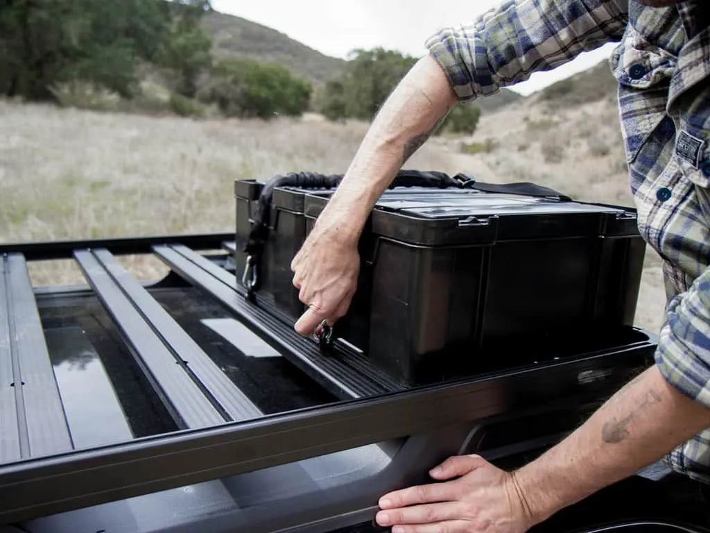 Cub Pack in use on a roof rack, secured with Stratchits and Black Tie Down Rings for safe overlanding storage.