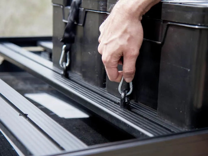 Cub Pack being carried by hand, highlighting lightweight, compact design and ergonomic grips.