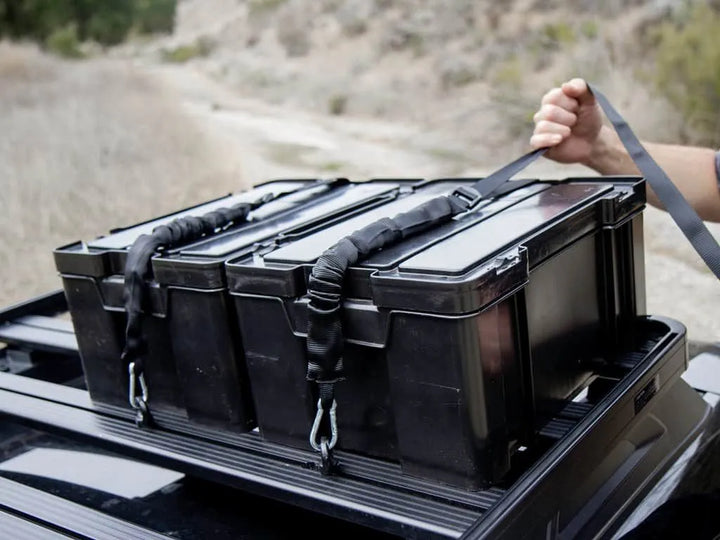 Multiple Cub Packs stacked securely, demonstrating the nesting lid design for stable transport.

